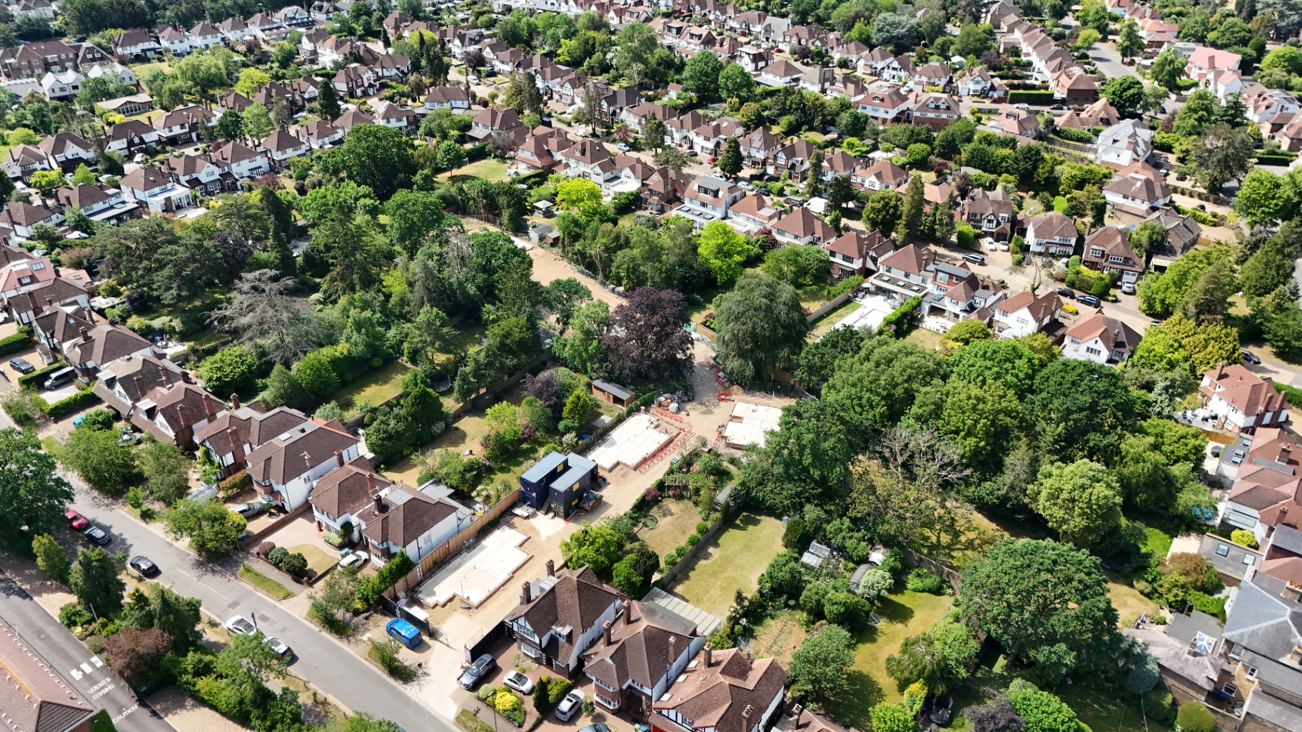 Aerial site progress with surrounding context